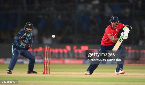 Alex Hales of England bats watched on by Mohammad Rizwan of Pakistan during the 1st IT20 match between Pakistan and England at Karachi National...