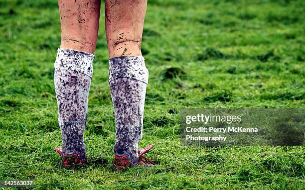 dirty legs in grass field - ottawa people stock pictures, royalty-free photos & images