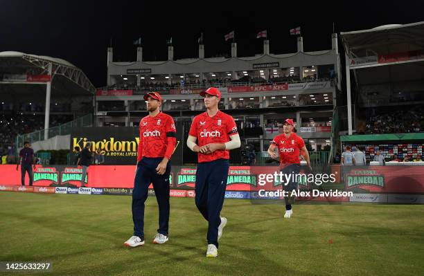 Dawid Malan and Harry Brook of England take to the field during the 1st IT20 match between Pakistan and England at Karachi National Stadium on...