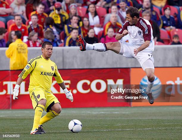 Brian Mullan of Colorado Rapids tries to disrupt the kick of goalie Nick Rimando of Real Salt Lake during the first half of an MLS soccer game April...