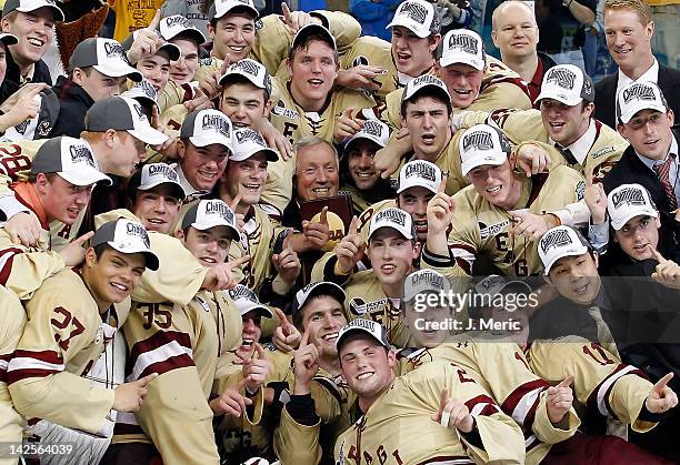 The Boston College Eagles pose for a photo after their victory over the Ferris State Bulldogs during the NCAA Division 1 Men's Hockey Championship...