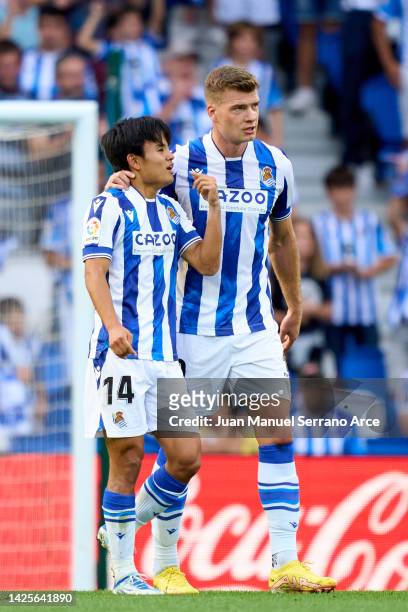 Alexander Sorloth of Real Sociedad celebrates with his teammate Takefusa Kubo of Real Sociedad after scoring the opening goal during the LaLiga...