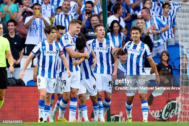 Alexander Sorloth of Real Sociedad celebrates with his teammate Takefusa Kubo of Real Sociedad after scoring the opening goal during the LaLiga...