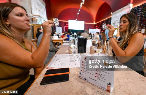 Participants try different wines during a presentation to the press of the new European campaign of Wines of Spain and Portugal by ViniPortugal in...