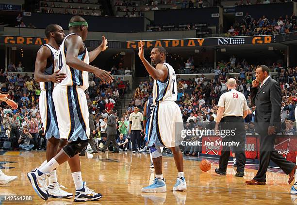 Gilbert Arenas, Quincy Pondexter and Zach Randolph of the Memphis Grizzlies celebrate against the Dallas Mavericks on April 7, 2012 at FedExForum in...