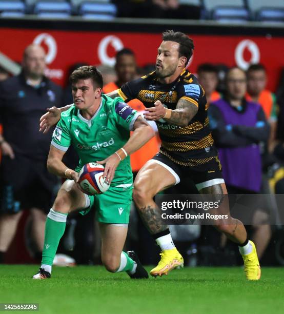 James Blackett of Newcastle Falcons is held by Francois Hougaard during the Premiership Rugby Cup match between Wasps and Newcastle Falcons at The...