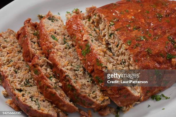 moist turkey and spinach meatloaf - cooked turkey white plate imagens e fotografias de stock