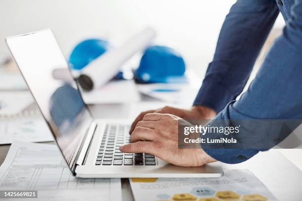 architect, engineer or business man typing on a laptop working on a construction design in an office. closeup hands of a building planner using a computer app or website to draw a plan - website imagens e fotografias de stock