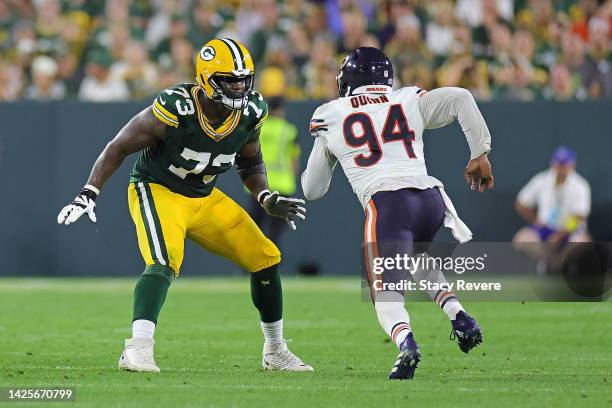 Yosh Nijman of the Green Bay Packers works against Robert Quinn of the Chicago Bears during a game at Lambeau Field on September 18, 2022 in Green...