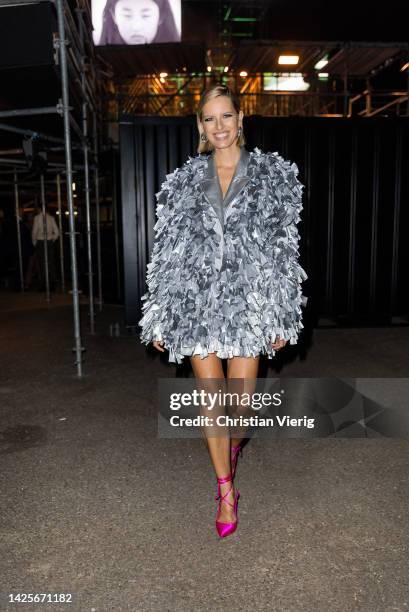 Karolina Kurkova wears silver jacket, pink heels outside About You Fashion Week during the Milan Fashion Week - Womenswear Spring/Summer 2023 on...