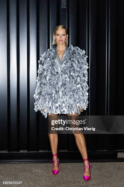 Karolina Kurkova wears silver jacket, pink heels outside About You Fashion Week during the Milan Fashion Week - Womenswear Spring/Summer 2023 on...