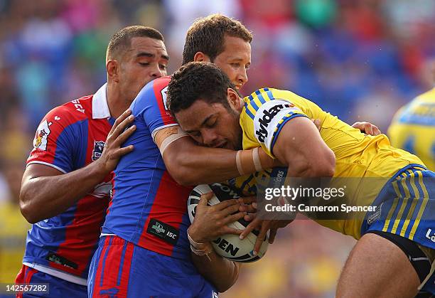 Jarryd Hayne of the Eels is tackled during the round six NRL match between the Newcastle Knights and the Parramatta Eels at Hunter Stadium on April...