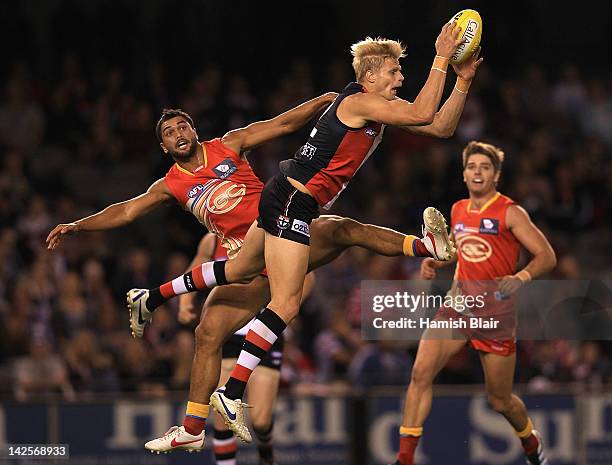 Nick Riewoldt of the Saints marks over Karmichael Hunt of the Suns during the round two AFL match between the St Kilda Saints and the Gold Coast Suns...