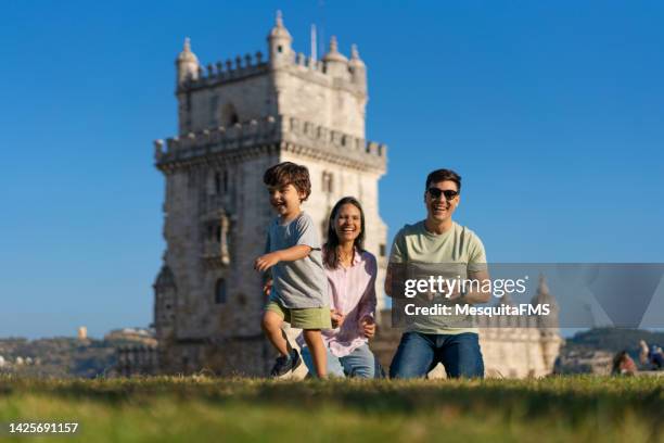 family playing in the grass - portugal travel stock pictures, royalty-free photos & images