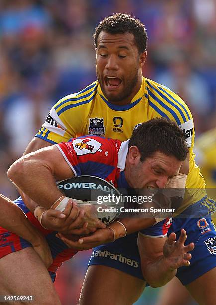 Danny Buderus of the Knights is tackled during the round six NRL match between the Newcastle Knights and the Parramatta Eels at Hunter Stadium on...