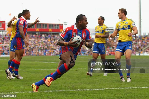 Akuila Uate of the Knights scores a try during the round six NRL match between the Newcastle Knights and the Parramatta Eels at Hunter Stadium on...