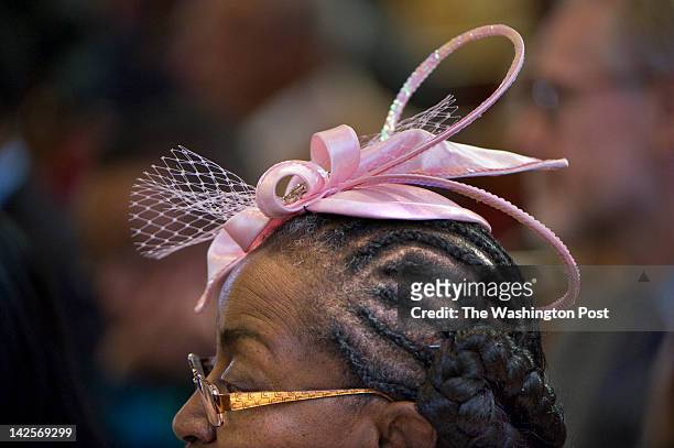 Lillie Alexander wears a dazzling pink hat to church on palm sunday at Zion Baptist Church in Washington, DC on April 1, 2012. Although wearing hats...