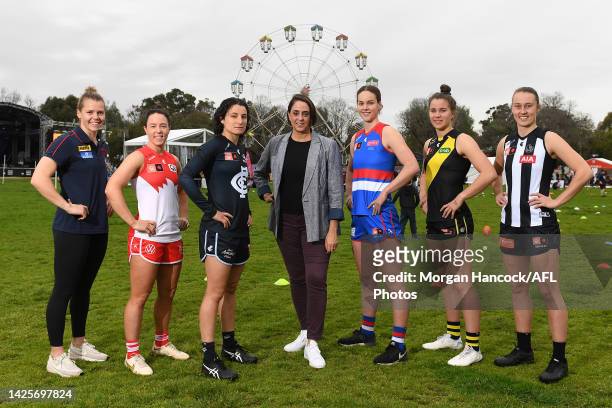 Nicole Livingstone , AFL Head of Women's Football poses alongside Maddison Gay of the Melbourne Demons, Brooke Lochland of the Sydney Swans,...