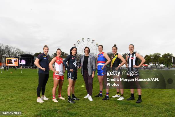 Nicole Livingstone , AFL Head of Women's Football poses alongside Maddison Gay of the Melbourne Demons, Brooke Lochland of the Sydney Swans,...