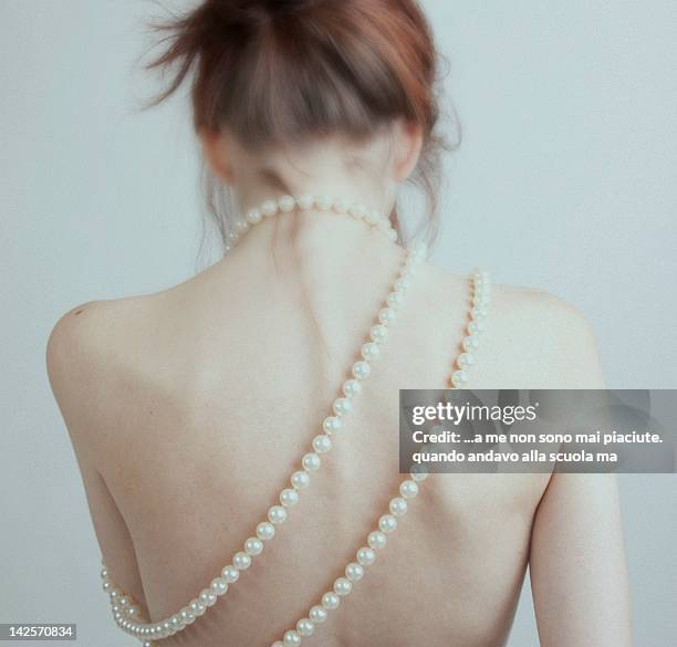 woman from behind with pearl necklace - alla moda stock pictures, royalty-free photos & images