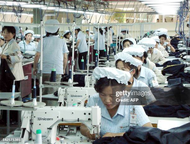 NKorea-SKorea-Kaesong-projects,sched North Korean female workers toil at a South Korean-run plant in the inter-Korean industrial complex in Kaesong,...