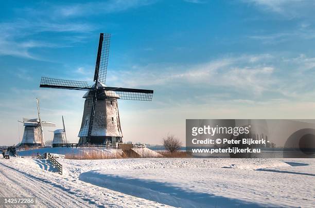 windmills in winter - netherlands stock pictures, royalty-free photos & images