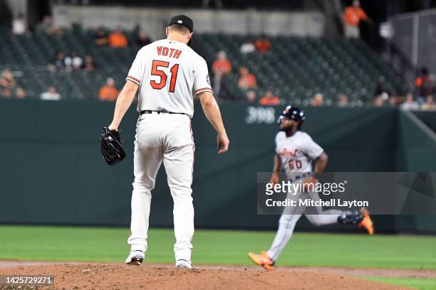 Austin Voth of the Baltimore Orioles looks on after Akil Baddoo of the Detroit Tigers hit a two-run home run during the third inning of a baseball...