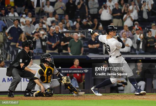 Aaron Judge of the New York Yankees hits his 60th home run of the season during the 9th inning of the game against the Pittsburgh Pirates at Yankee...