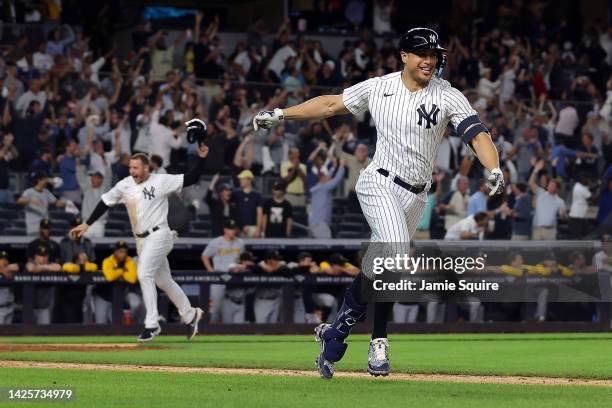 Giancarlo Stanton of the New York Yankees celebrates as he hits a walk-off grand-slam home run to end the game during the 9th inning of the game...