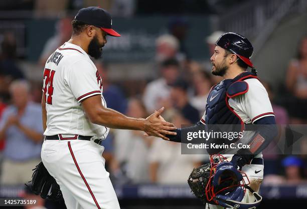 Kenley Jansen of the Atlanta Braves reacts with Travis d'Arnaud after their 3-2 win over the Washington Nationals at Truist Park on September 20,...