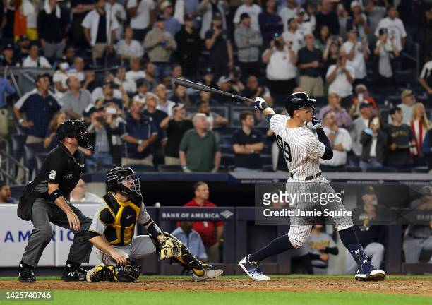 Aaron Judge of the New York Yankees hits his 60th home run of the season during the 9th inning of the game against the Pittsburgh Pirates at Yankee...
