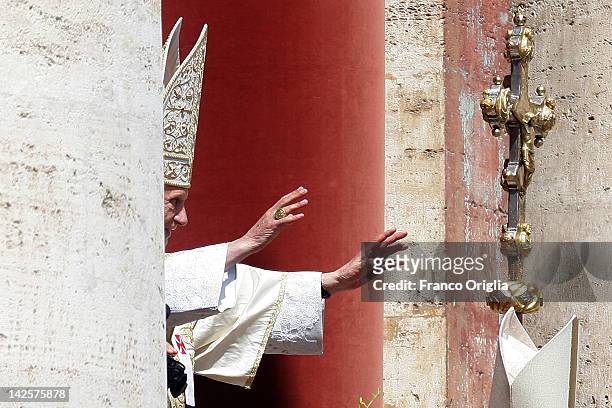 Pope Benedict XVI delivers his 'Urbi et Orbi' message and blessing from the central balcony of St. Peter's Basilica at the end of the Easter Mass on...
