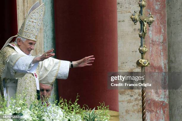 Pope Benedict XVI delivers his 'Urbi et Orbi' message and blessing from the central balcony of St. Peter's Basilica at the end of the Easter Mass on...