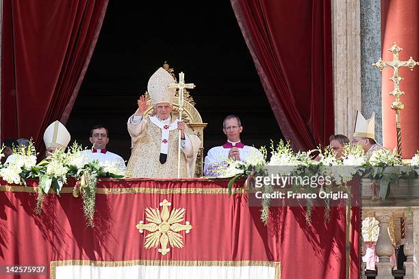 Pope Benedict XVI delivers his 'Urbi et Orbi' message and blessing from the central balcony of St. Peter's Basilica at the end of the Easter Mass on...