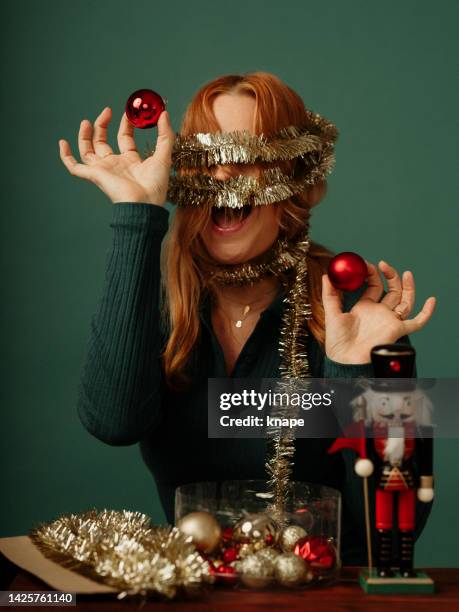 christmas time - woman going crazy over christmas decorations - christmas stress stock pictures, royalty-free photos & images