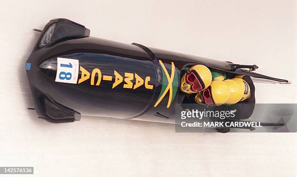 The Jamaican 4-man bobsled speeds down the track during the first run of the men's competition 27 February 1988 at the Calgary Winter Olympic Games....