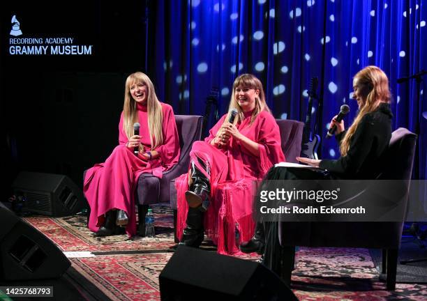 Holly Laessig and Jess Wolfe of Lucius speak with Evan Rachel Wood at The Drop: Lucius at The GRAMMY Museum on September 20, 2022 in Los Angeles,...