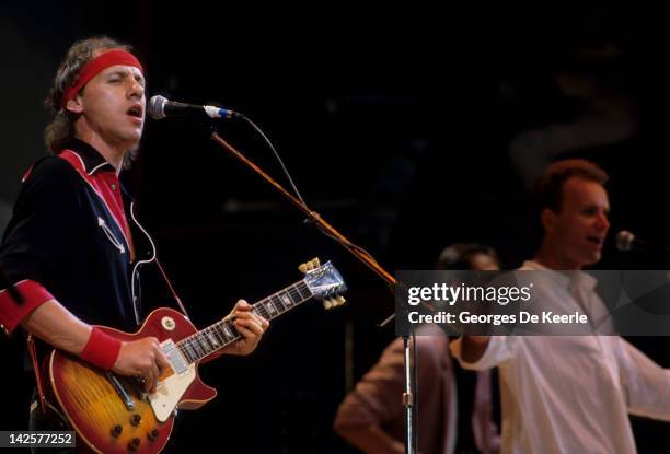 Singers Sting and Mark Knopfler from rock band Dire Straits perform at the Live Aid concert at Wembley Stadium in London, 13th July 1985. The concert...