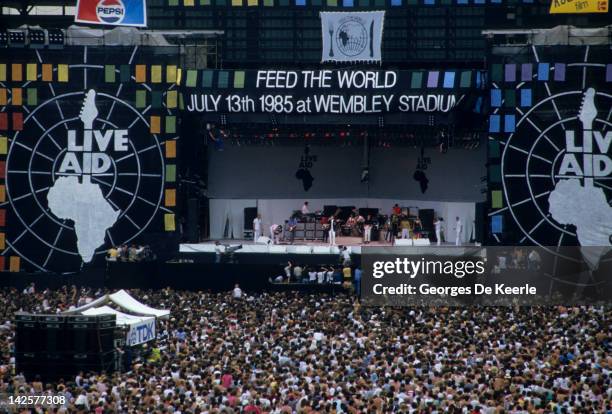 General view of the crowd and the stage during the Live Aid concert at Wembley Stadium in London, 13th July 1985. The concert raised funds for famine...