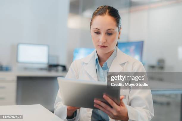 medical woman, lab and typing on tablet for research or analysis of scientific record on the web. science girl reading digital news for medicine breakthrough and clinical technology innovation. - clinic stockfoto's en -beelden