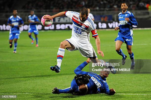 Lyon's Argentinian forward Lisandro Lopez vies with Auxerre's Israelian forward Ben Sahar during the French L1 football match Lyon vs Auxerre on...