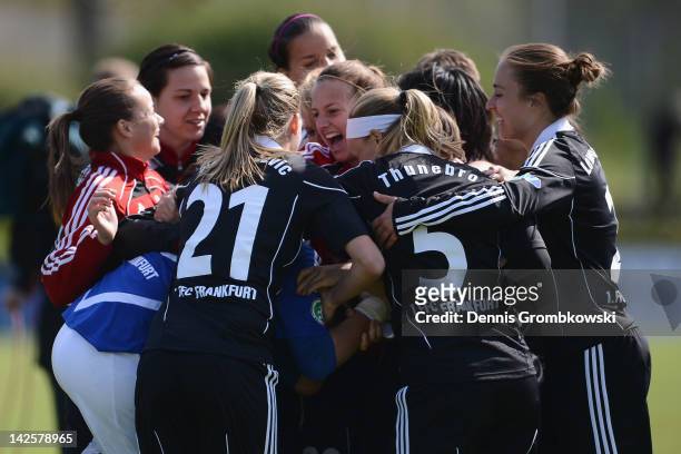 Goalkeeper Desiree Schumann of Frankfurt celebrates with teammates after the Women's DFB Cup semi final match between 1. FFC Frankfurt and FCR...