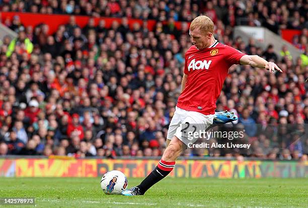 Paul Scholes of Manchester United scores his team's second goal during the Barclays Premier League match between Manchester United and Queens Park...