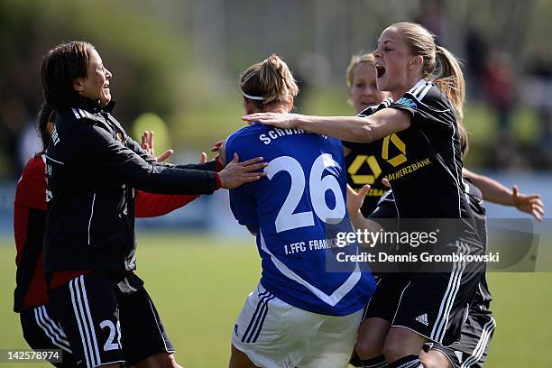 Goalkeeper Desiree Schumann of Frankfurt celebrates with teammates after the Women's DFB Cup semi final match between 1. FFC Frankfurt and FCR...