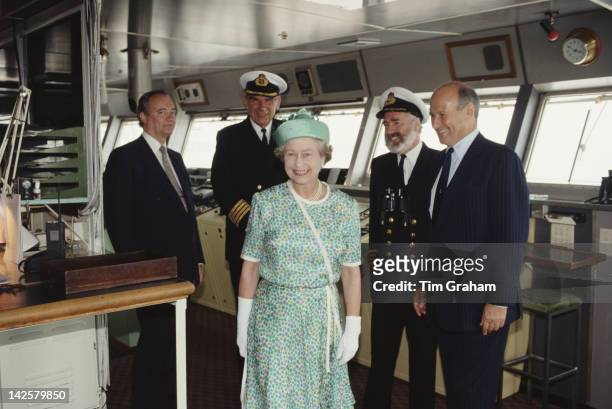 Queen Elizabeth II in the bridge of the cruise liner 'QE2' in Southampton, 27th July 1990.