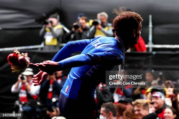 Silver medalist Matteo Sobrero of Italy throws a bouquet of flowers to the public on the podium ceremony after the 95th UCI Road World Championships...