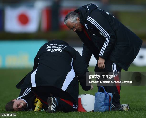 Kerstin Garefrekes of Frankfurt is treated during the Women's DFB Cup semi final match between 1. FFC Frankfurt and FCR Duisburg at Brentanobad...