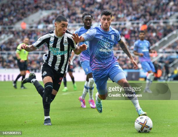 Miguel Almiron of Newcastle United and Marcos Senesi of AFC Bournemouth in action during the Premier League match between Newcastle United and AFC...
