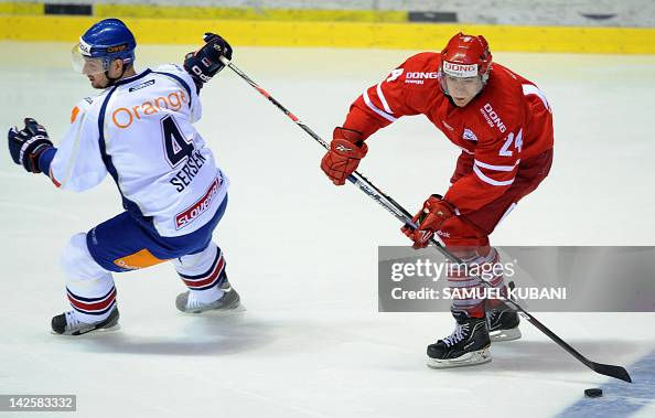 Sersen Slovak player Michal Sersen fights for the puck against Denmark... News ...