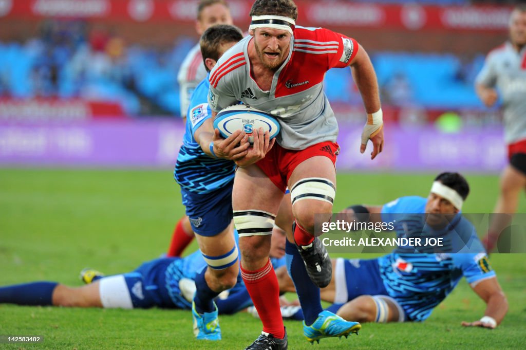 Crusaders's Kieran Read (C) scores a try